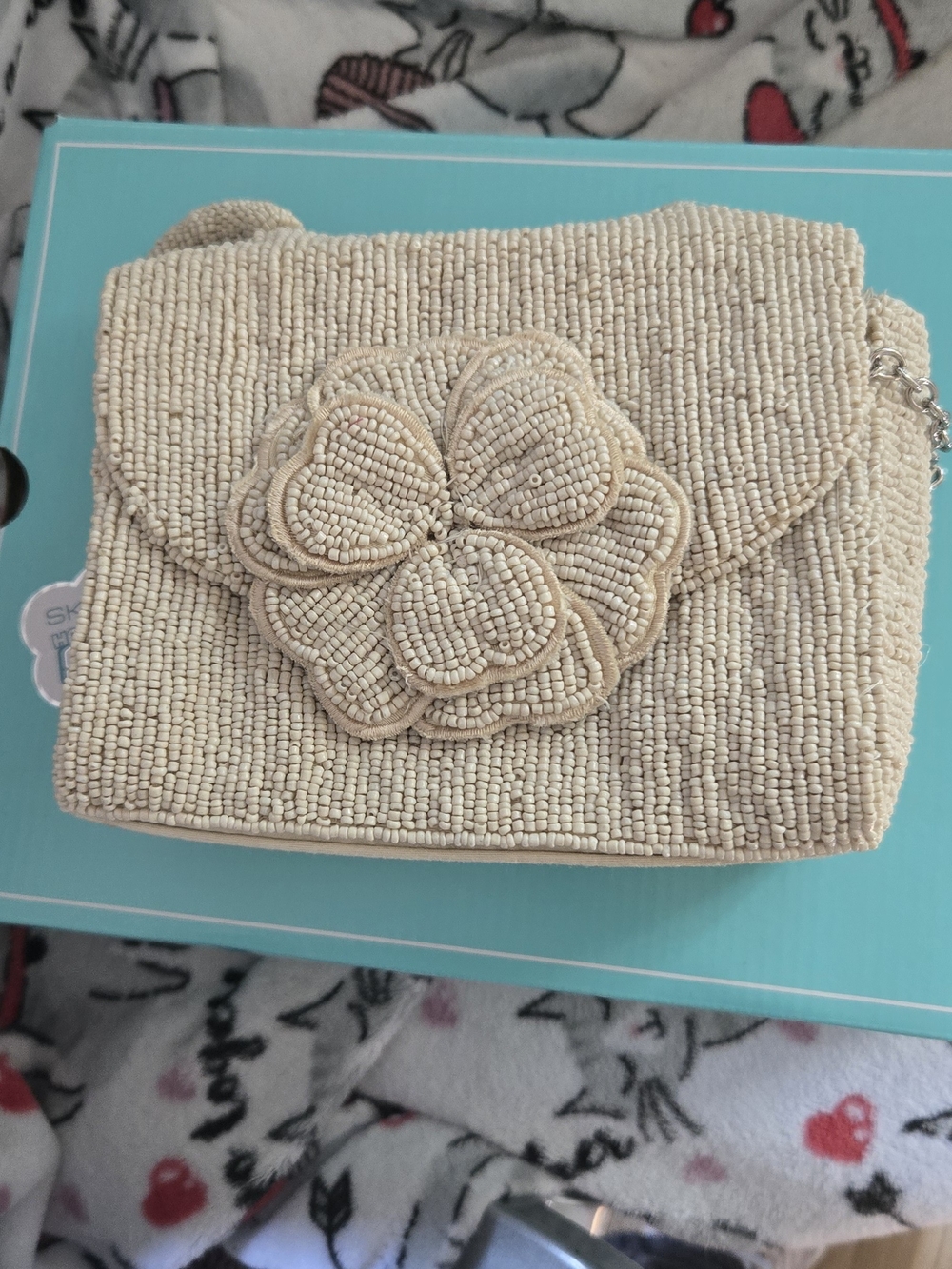 Kelly & Katie Beaded Flower Crossbody in Beige